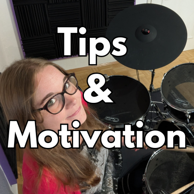 Female drummer with glasses playing hybrid drum kit